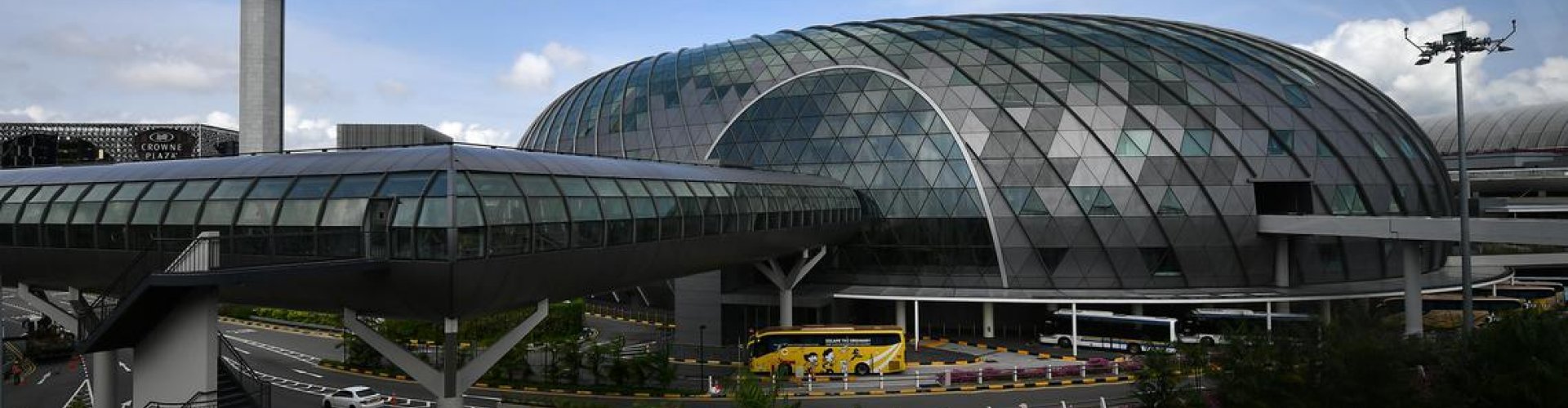 Sunset shot of Changi Intl Airport Terminal with family silhouetted