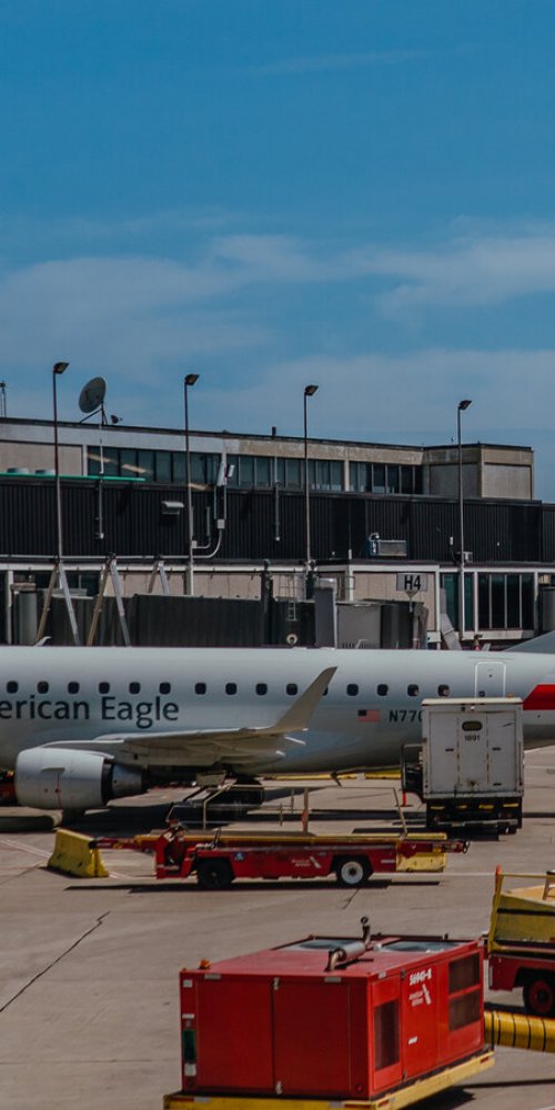 Parents and children enjoying quiet moments at a family-friendly lounge, O'Hare Airport