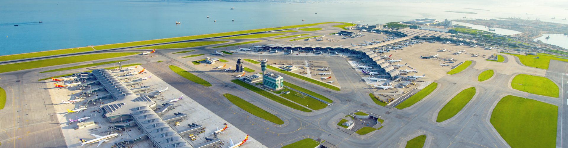 Sunset view of Hong Kong Intl Airport terminal