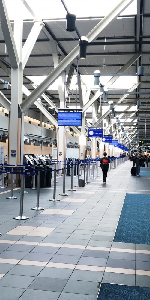 Parents and children resting comfortably at Vancouver Airport