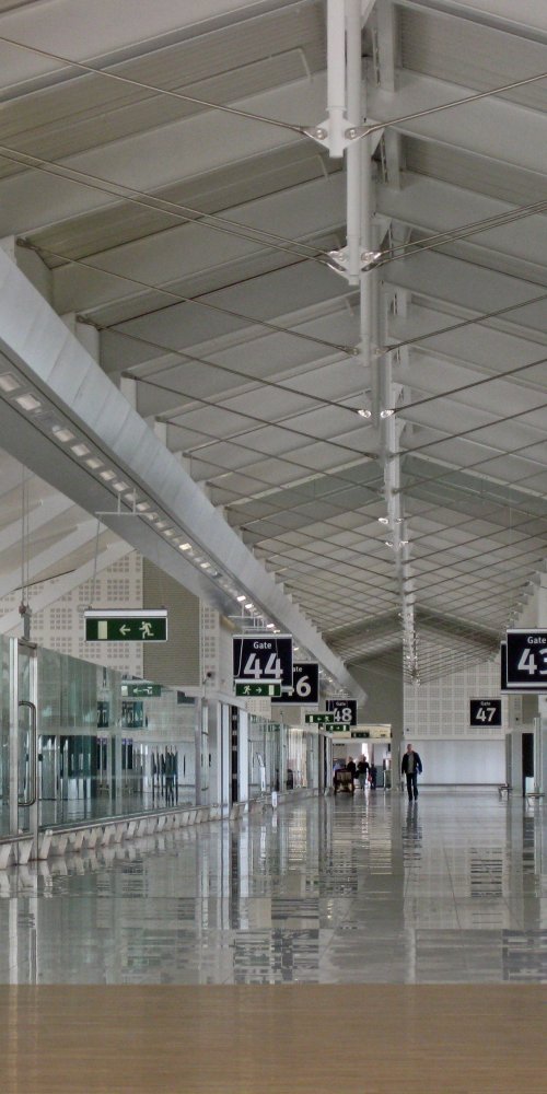 Mother and child resting in quiet area at Birmingham Airport