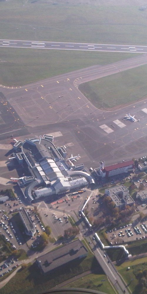 Parents and child relaxing at Vilnius Airport