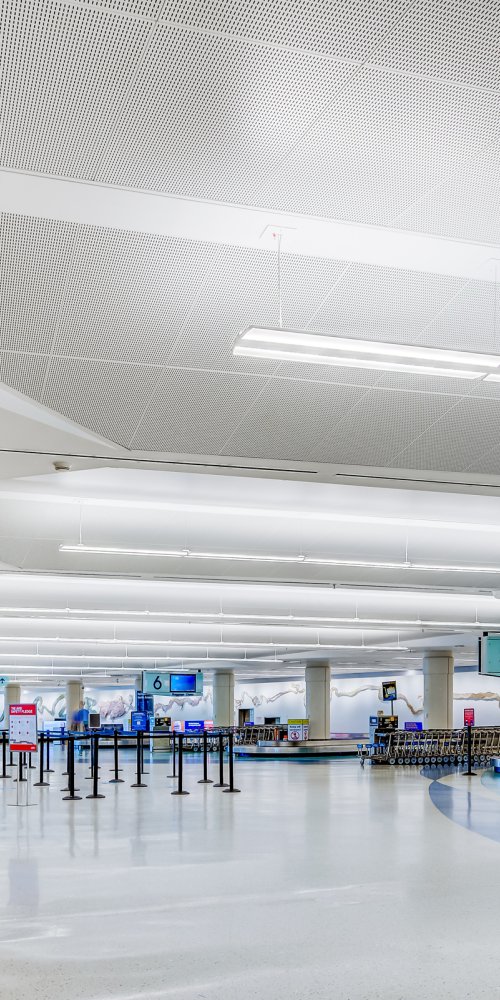 Family relaxing in Jacksonville Intl Airport play zone