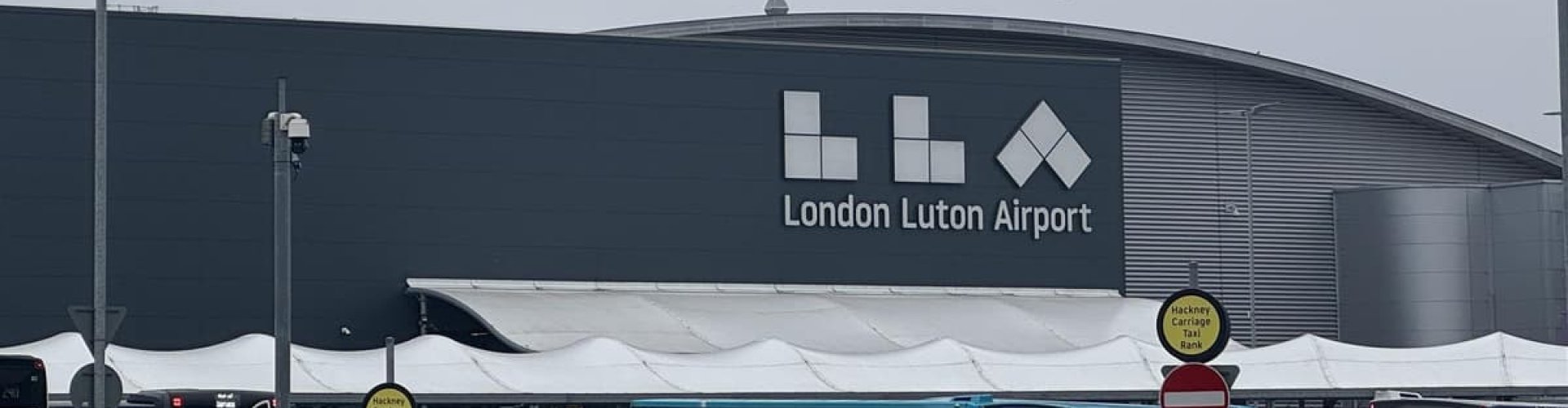Parents enjoying quiet time with children at Luton Airport, UK Airport