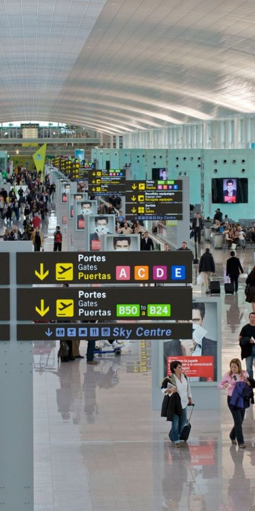 Parent and child enjoying family facilities at Barcelona El Prat Airport